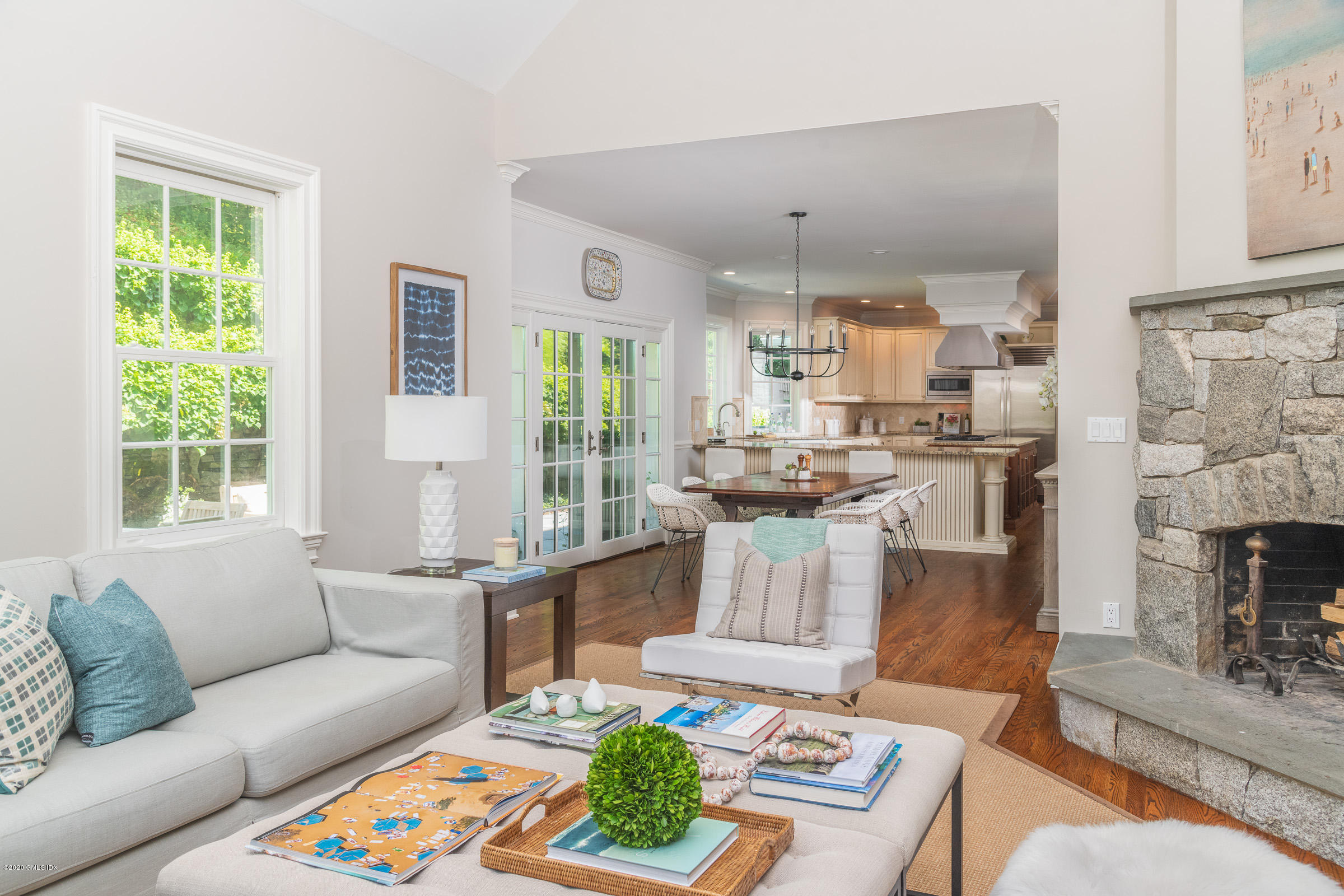 123 Valley Drive Greenwich, CT 06831 - Photo 16 of 48 a living room with fireplace furniture and a large window