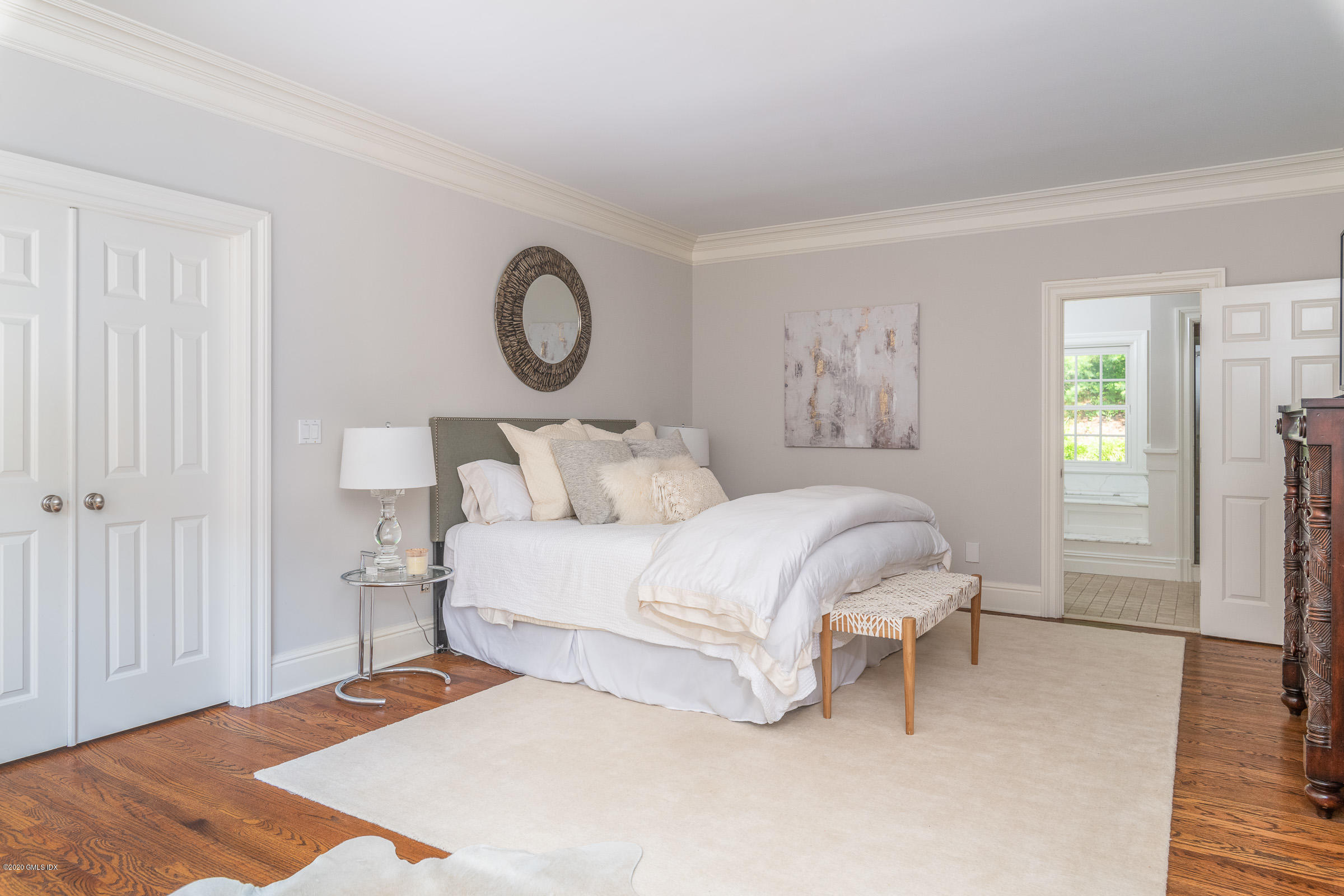 123 Valley Drive Greenwich, CT 06831 - Photo 21 of 48 a bedroom with a bed and window