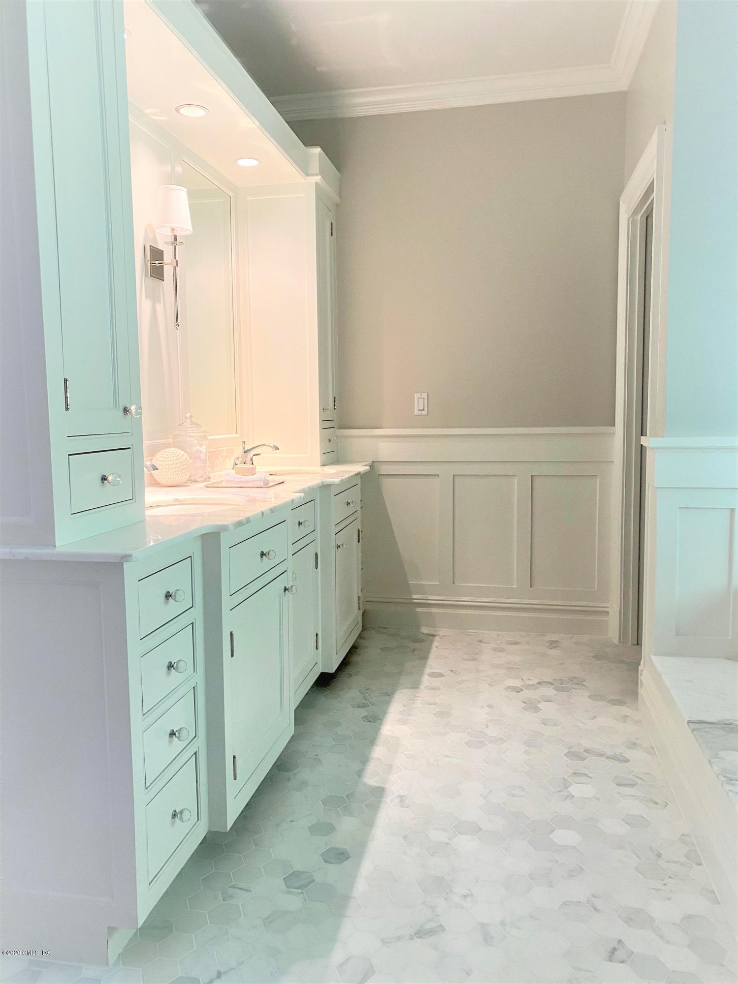 123 Valley Drive Greenwich, CT 06831 - Photo 22 of 48 a bathroom with a granite countertop sink mirror and