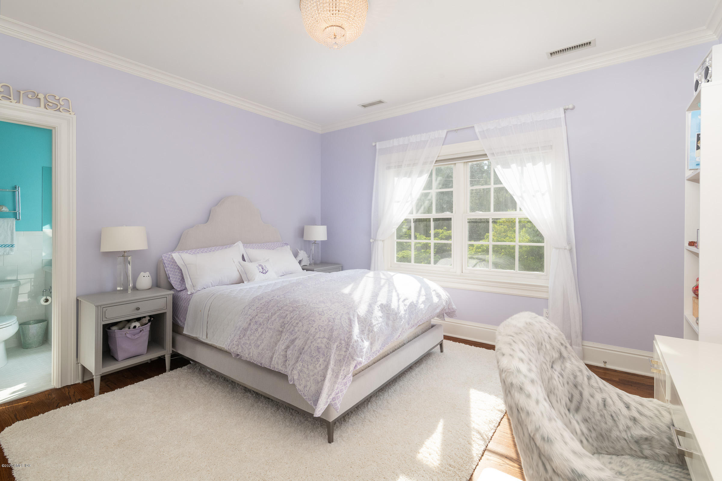 123 Valley Drive Greenwich, CT 06831 - Photo 23 of 48 a spacious bedroom with a bed and a window