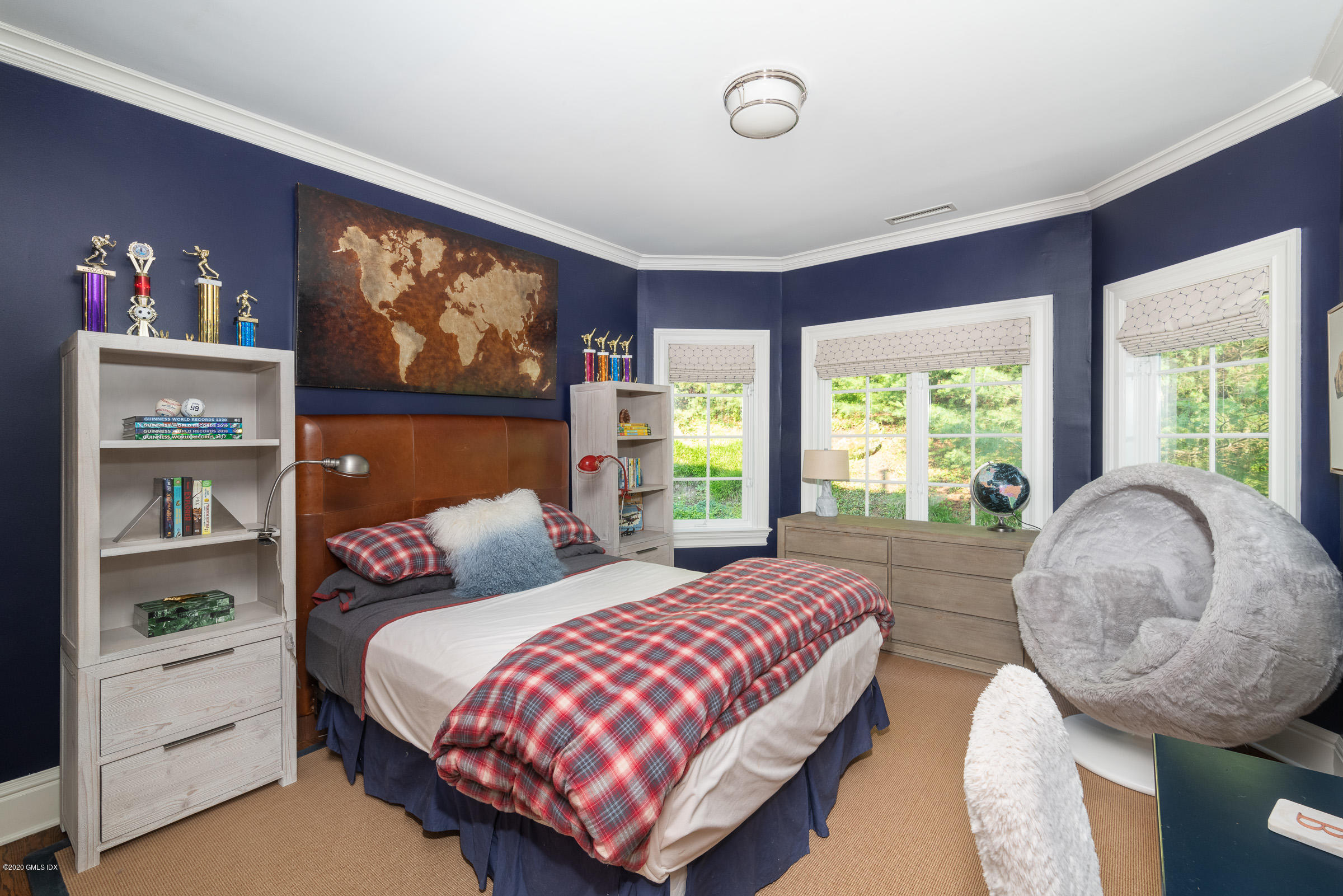 123 Valley Drive Greenwich, CT 06831 - Photo 25 of 48 a bedroom with a large bed and a large window