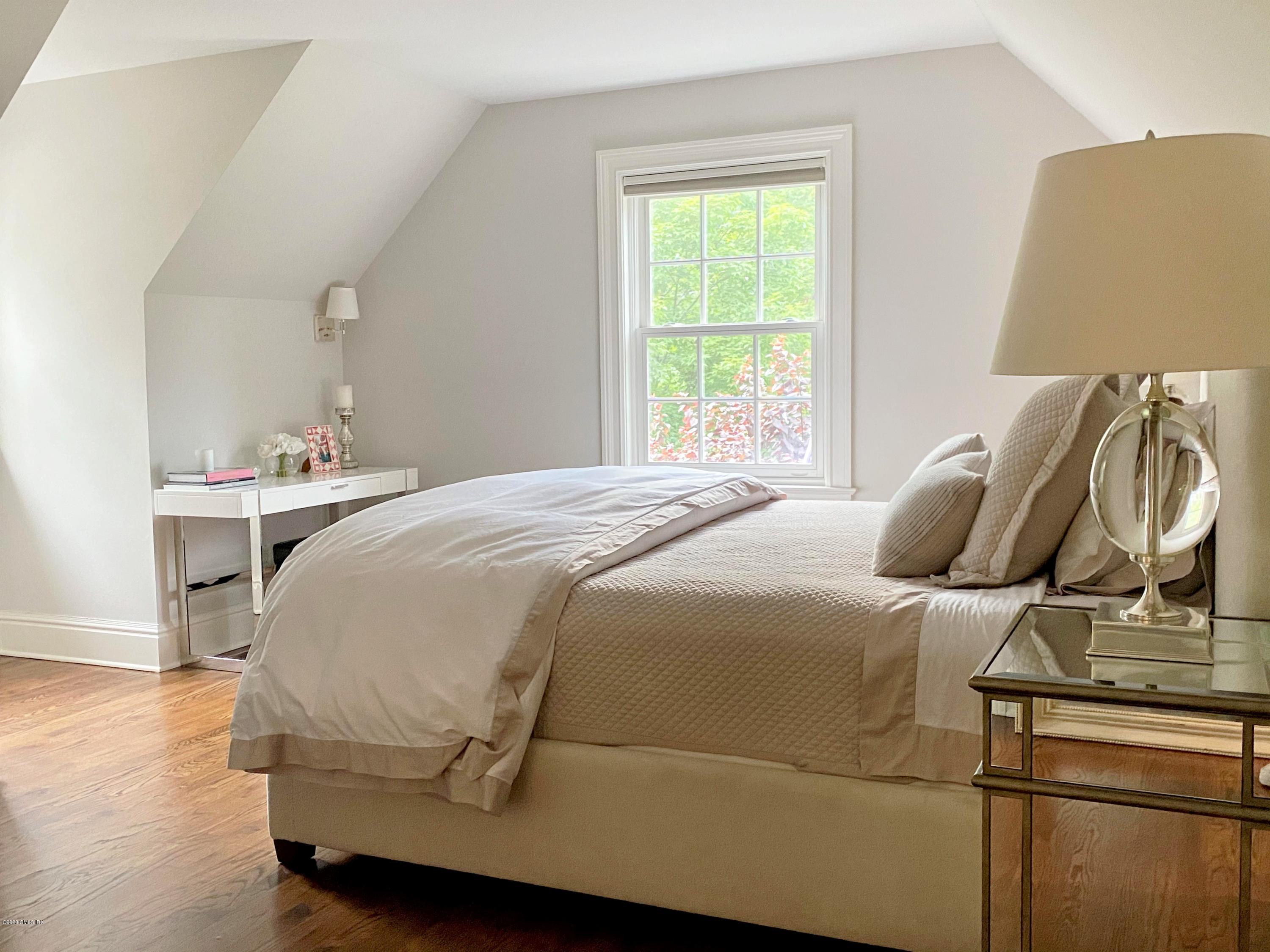 123 Valley Drive Greenwich, CT 06831 - Photo 26 of 48 a bedroom with a bed and window