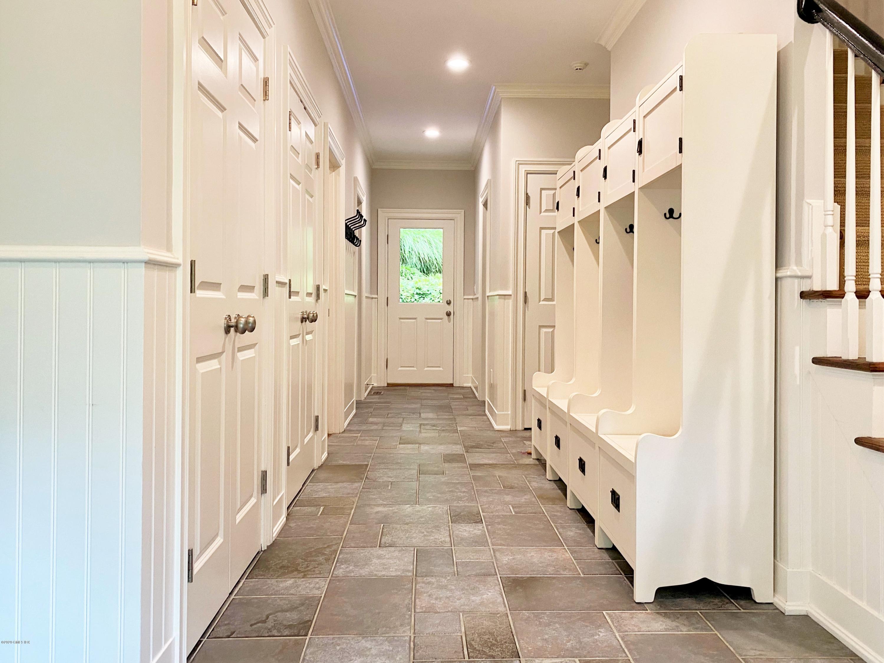 123 Valley Drive Greenwich, CT 06831 - Photo 30 of 48 a view of a hallway with windows