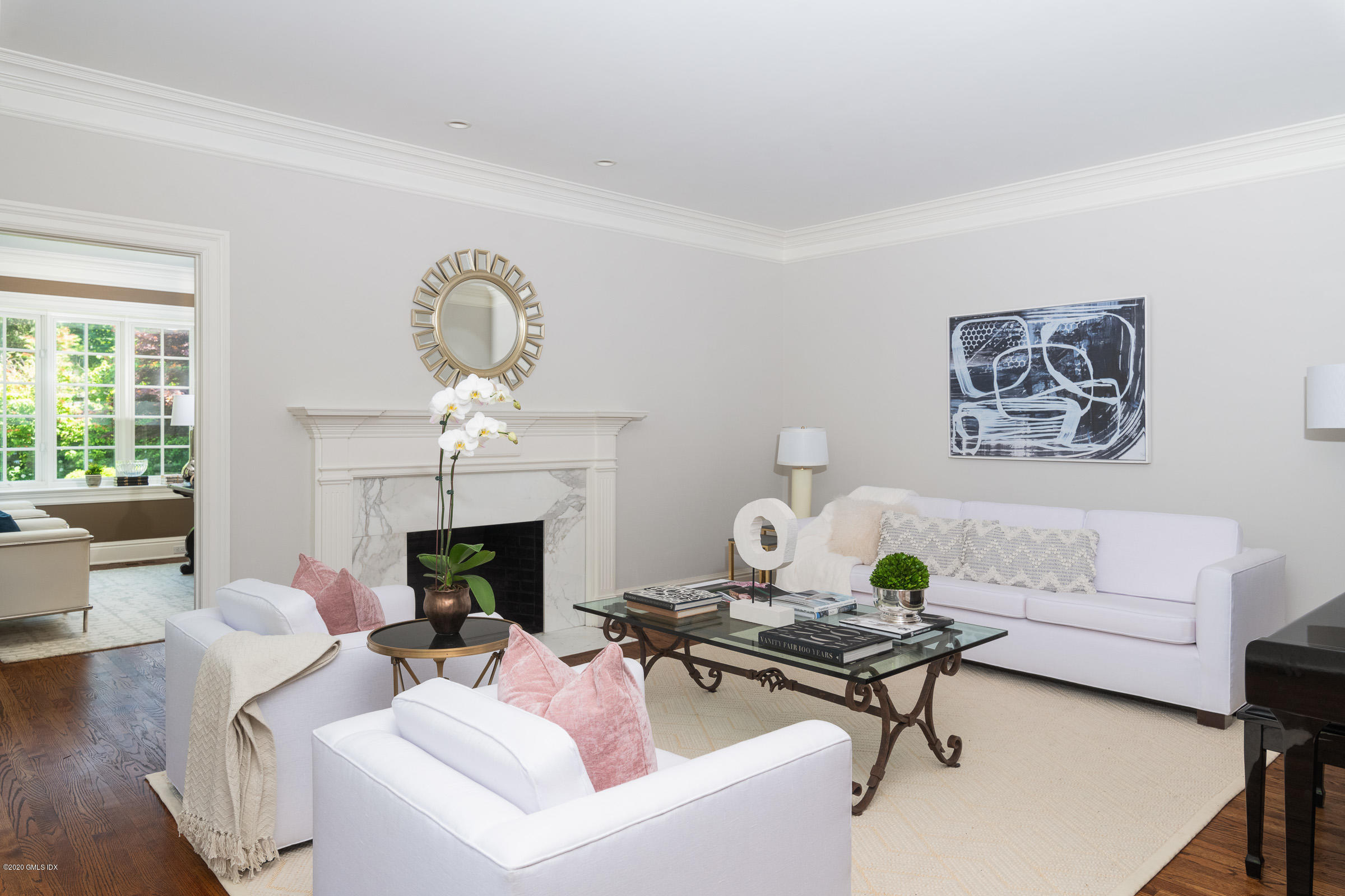 123 Valley Drive Greenwich, CT 06831 - Photo 3 of 48 a living room with furniture a fireplace and a table
