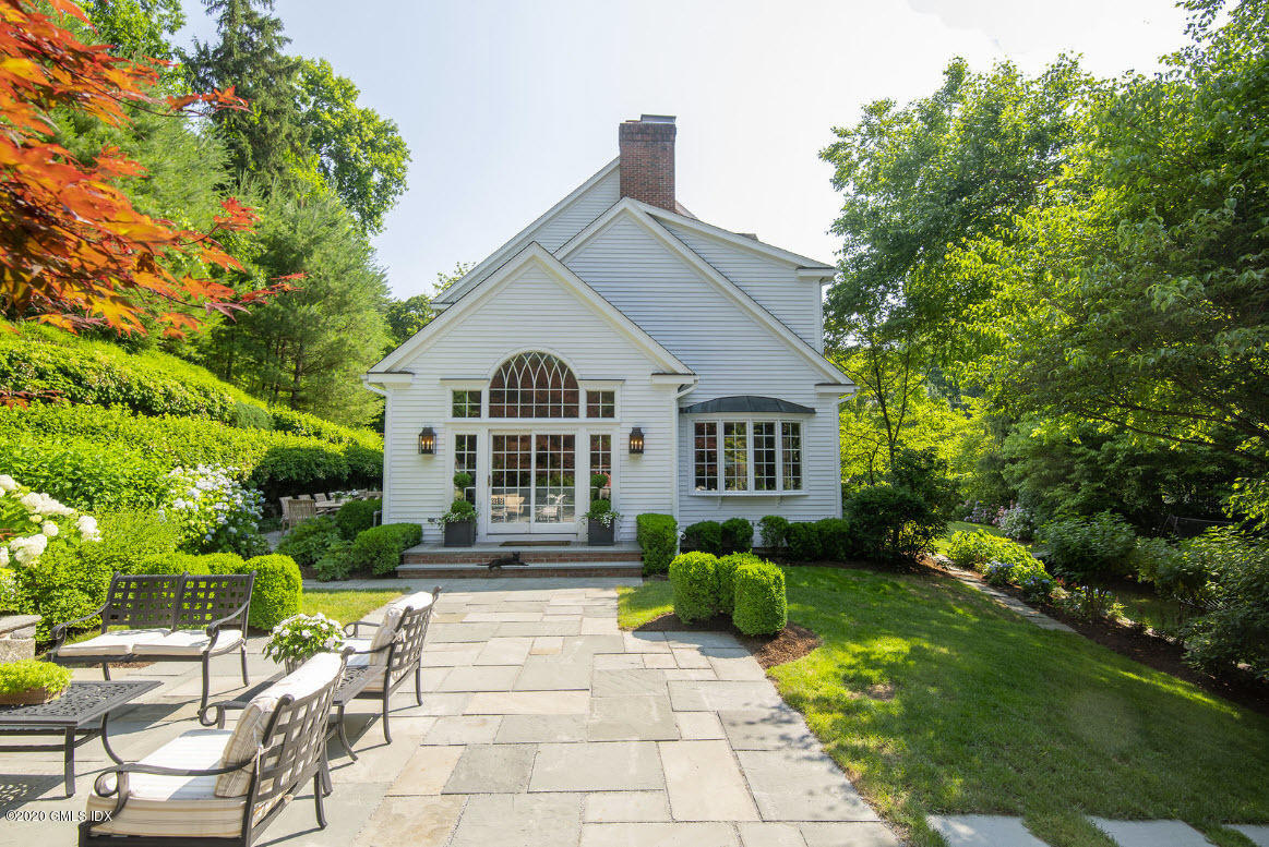123 Valley Drive Greenwich, CT 06831 - Photo 35 of 48 a view of a house with a yard