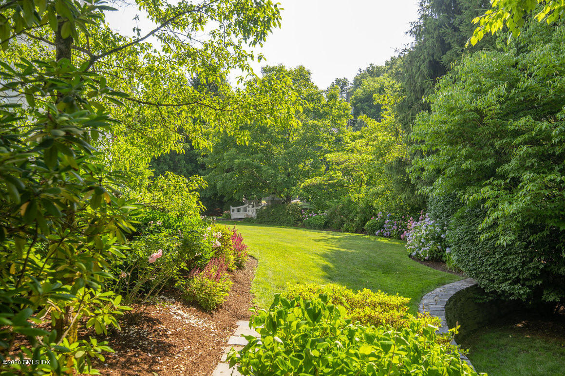 123 Valley Drive Greenwich, CT 06831 - Photo 37 of 48 a view of a garden with a tree