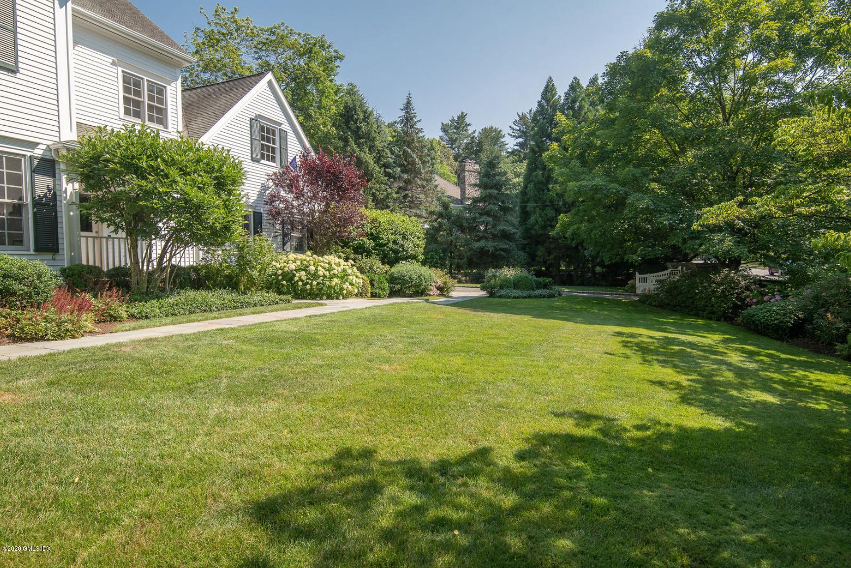 123 Valley Drive Greenwich, CT 06831 - Photo 38 of 48 a view of a house with a yard