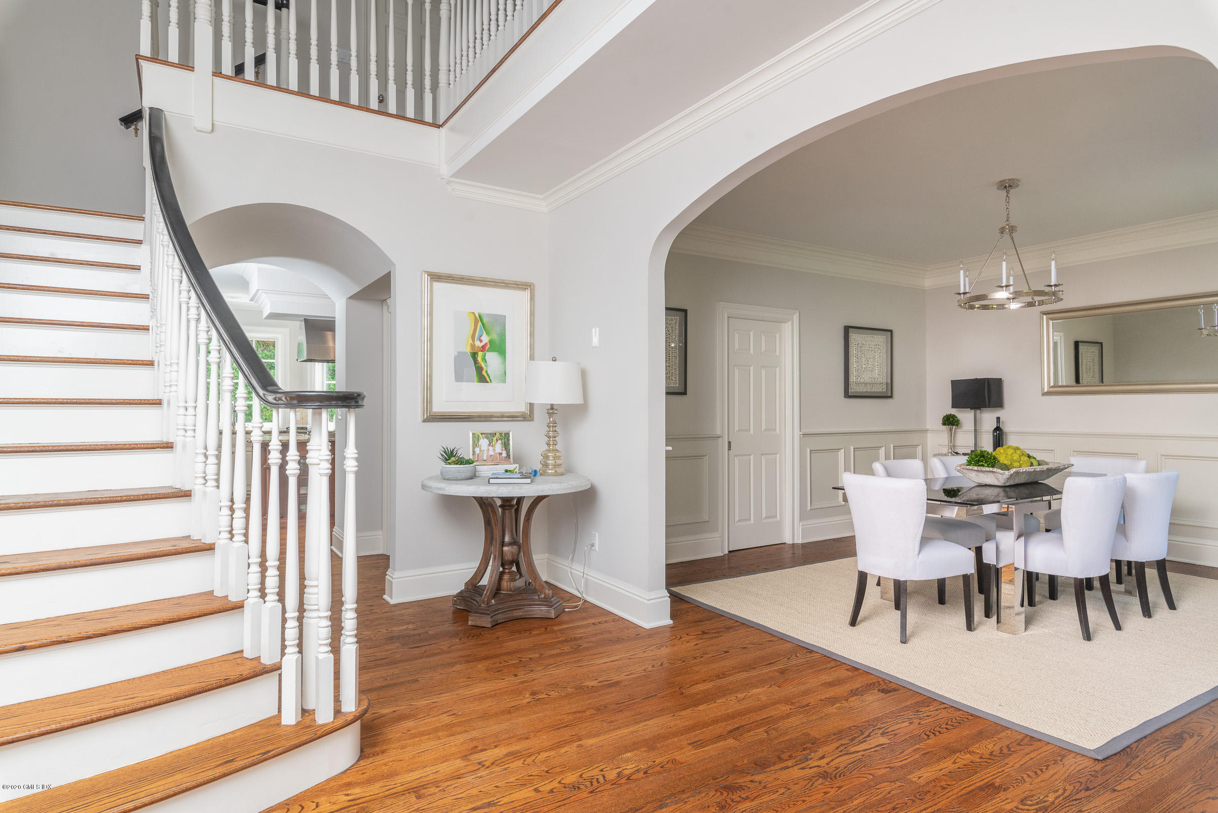 123 Valley Drive Greenwich, CT 06831 - Photo 4 of 48 a living room with furniture a dining table with wooden floor and a large window
