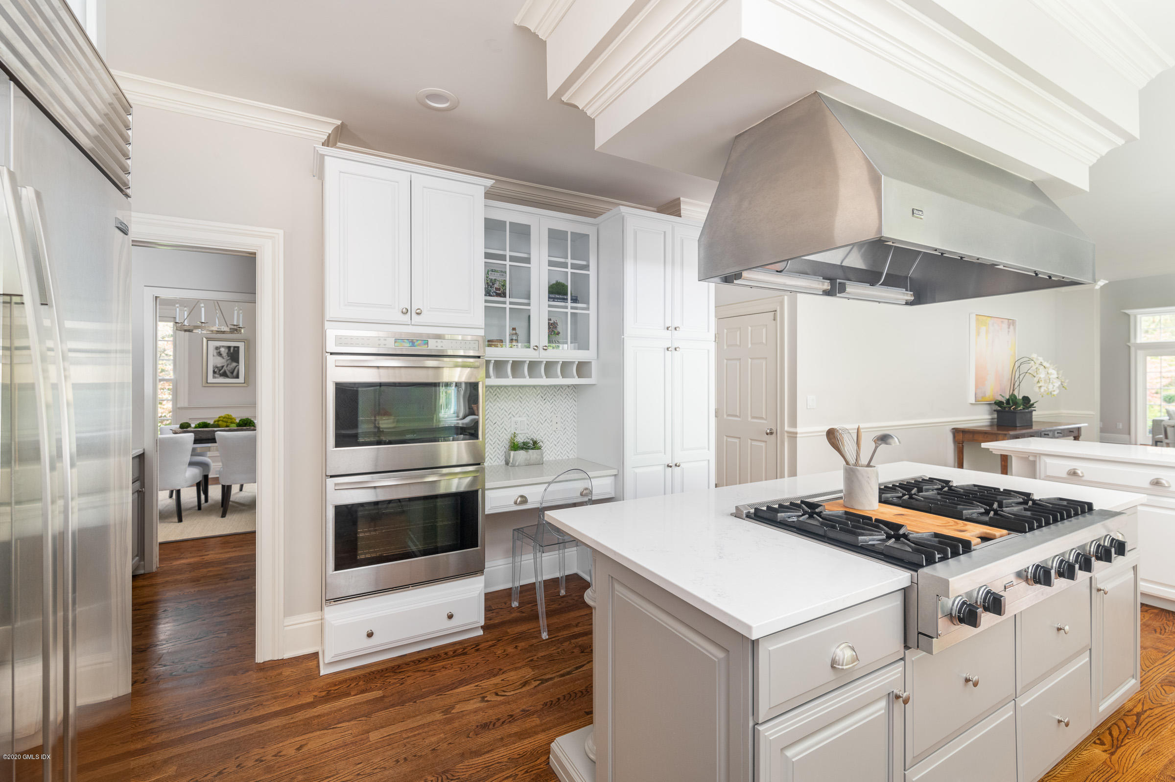 123 Valley Drive Greenwich, CT 06831 - Photo 7 of 48 a kitchen with stainless steel appliances a stove a sink and a refrigerator