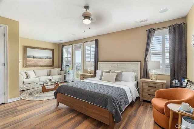 a bathroom with a sink a toilet a mirror and shower