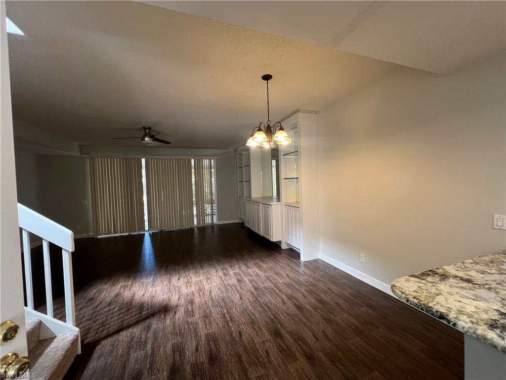 5365 Cove Circle, Unit 125 Naples, FL 34119 - Photo 14 of 36 a view of entryway with wooden floor