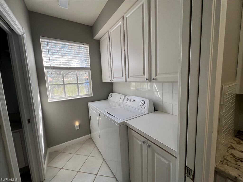 5365 Cove Circle, Unit 125 Naples, FL 34119 - Photo 17 of 36 a utility room with dryer and washer