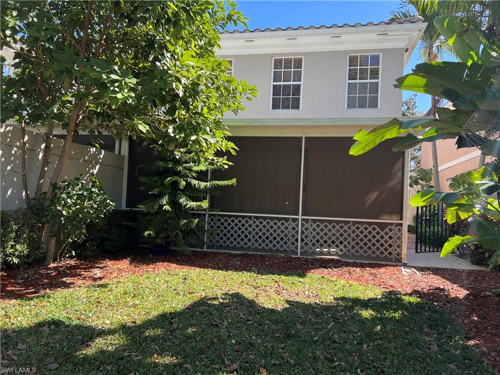 5365 Cove Circle, Unit 125 Naples, FL 34119 - Photo 26 of 36 a view of a backyard