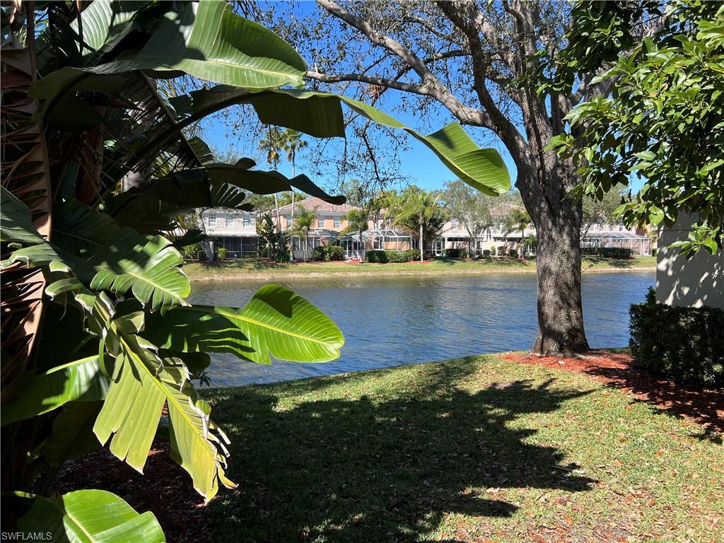 5365 Cove Circle, Unit 125 Naples, FL 34119 - Photo 28 of 36 a view of swimming pool from a garden