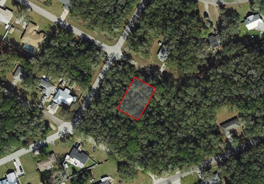 3582 East Lee Drive Inverness, FL 34453 - Photo 1 of 5 an aerial view of residential houses with outdoor space and trees