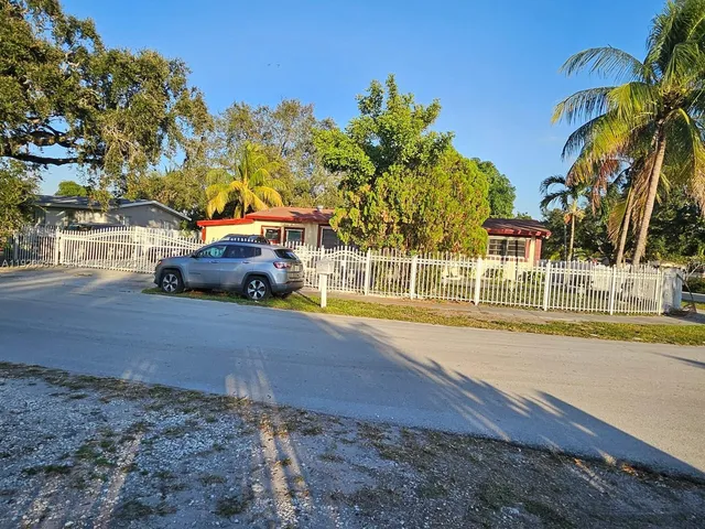 a view of street with parked cars