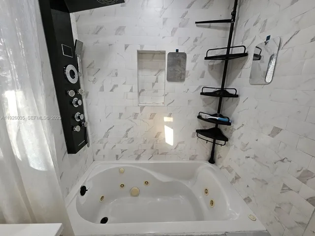 a bathroom with a bath tub