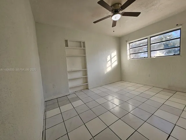 a view of an empty room and window