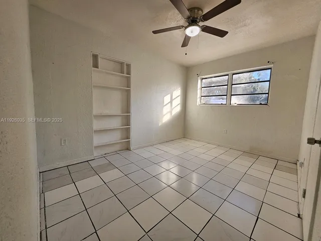 a view of an empty room and window