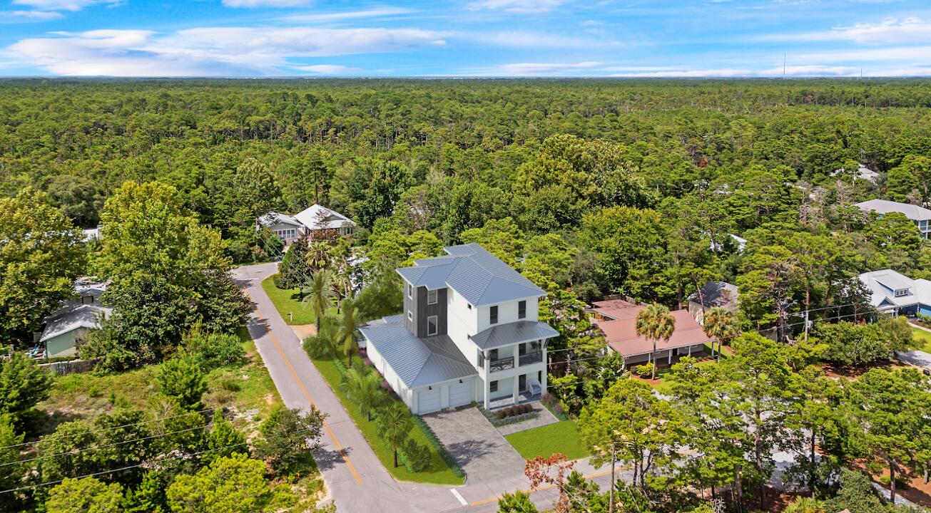 145 Walnut Street Santa Rosa Beach, FL 32459 - Photo 5 of 38 an aerial view of a house with a yard