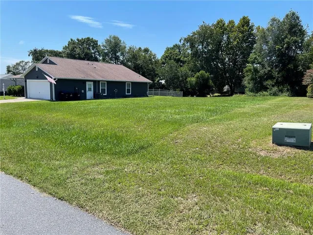 a front view of a house with yard