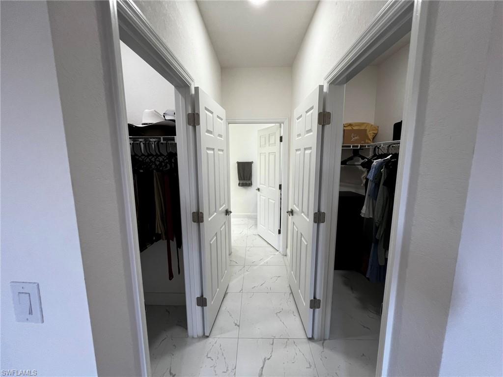 3313 68th Street West Lehigh Acres, FL 33971 - Photo 15 of 26 Corridor with marble finish floor