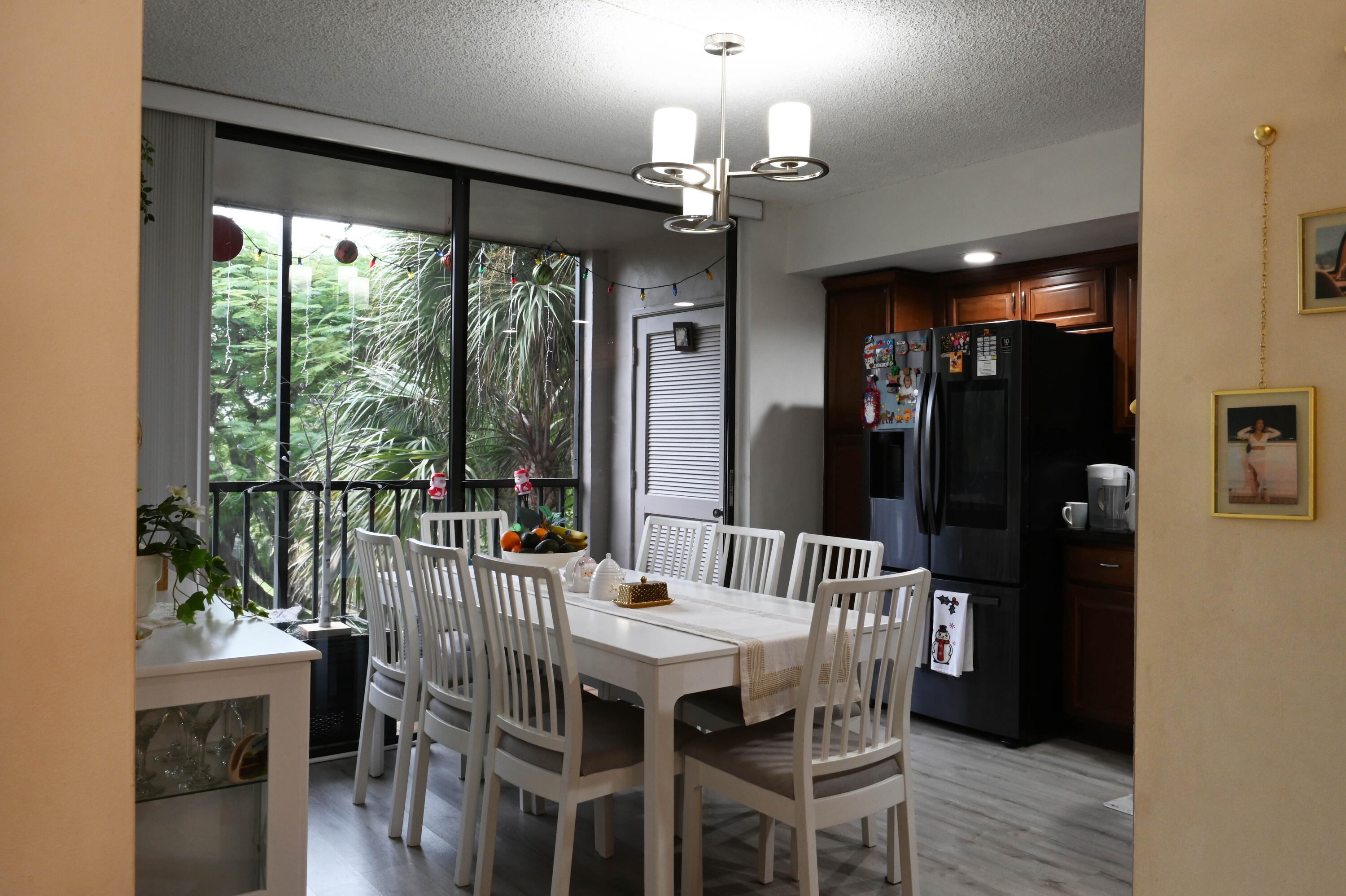 8400 Southwest 133rd Avenue Road, Unit 311 Miami, FL 33183 - Photo 5 of 11 a view of a dining room with furniture window and wooden floor