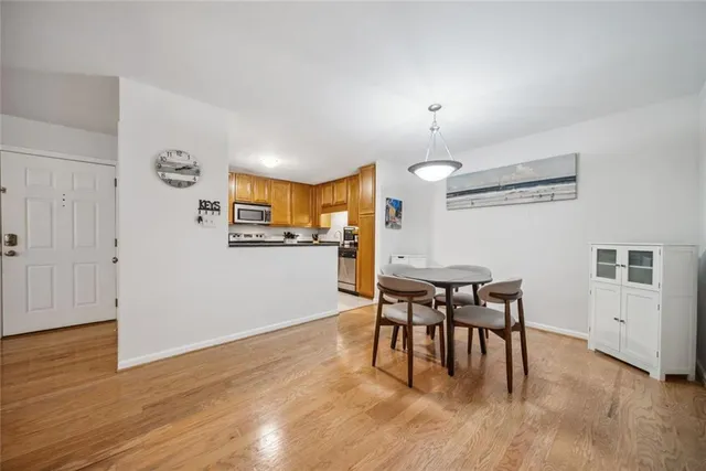 a view of a dining room with furniture and wooden floor