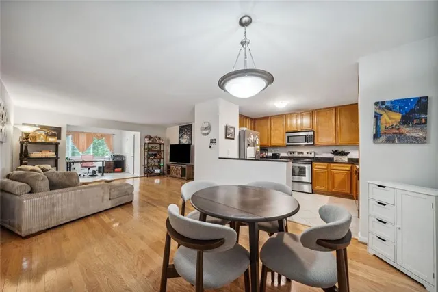 a living room with furniture and kitchen view
