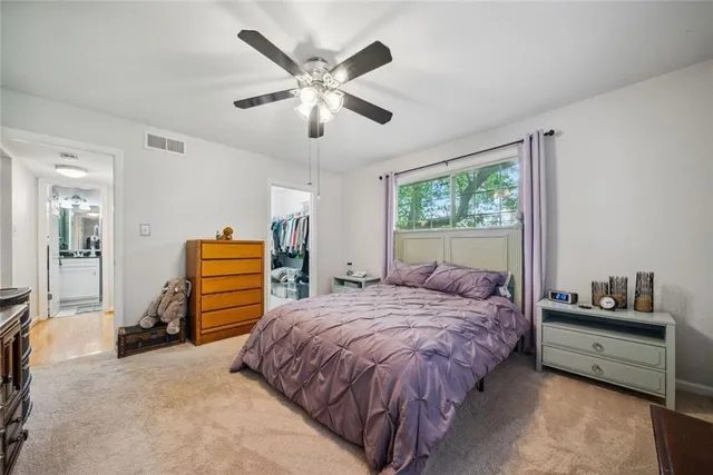 a bed room with a bed and a chandelier