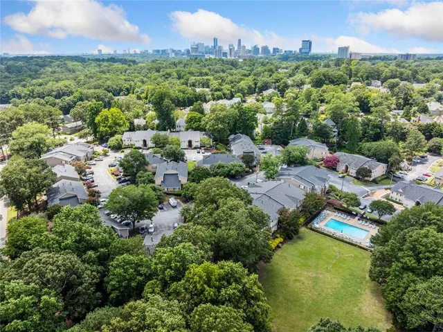 an aerial view of a houses with a yard