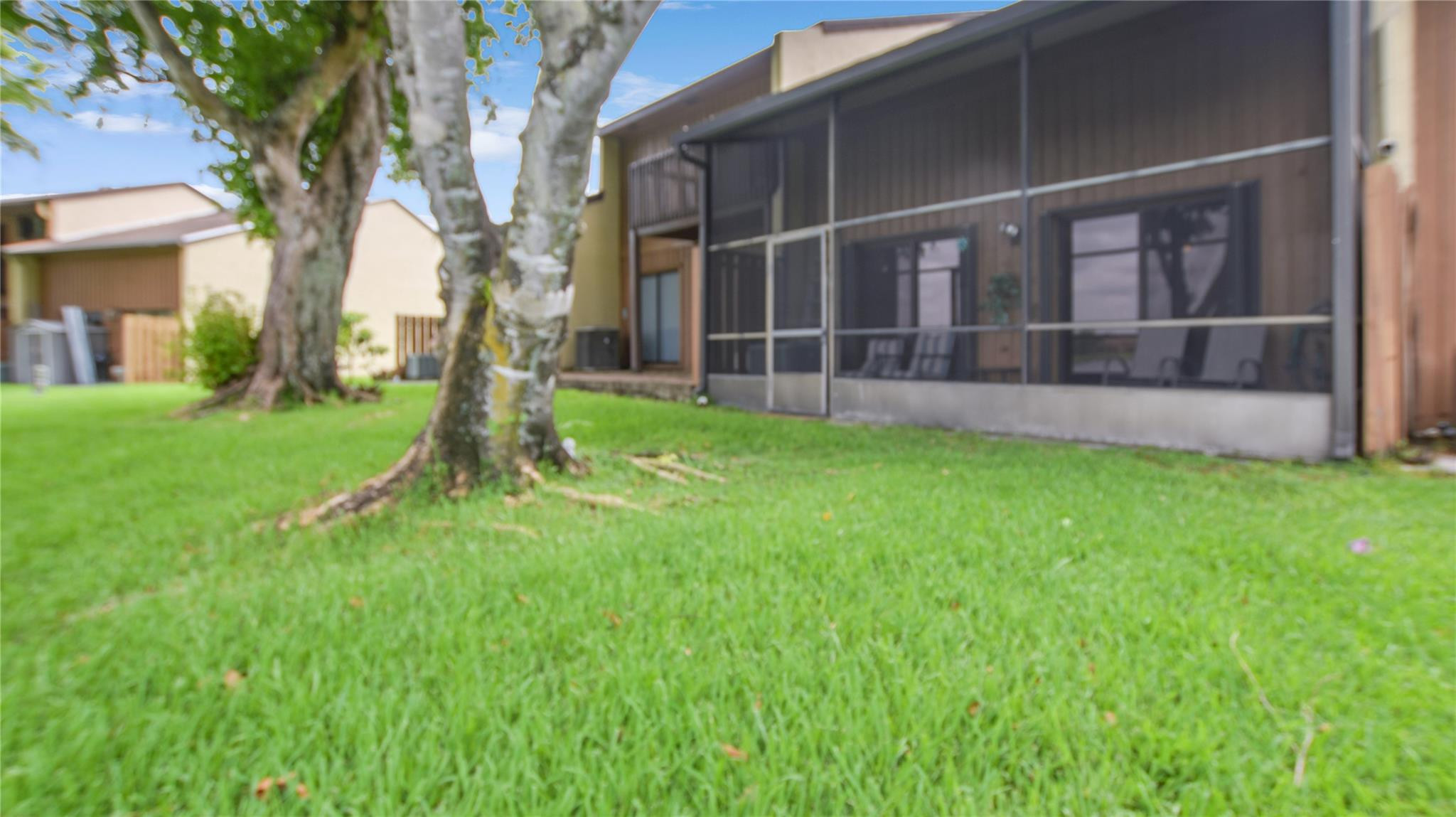4285 South Pine Island Road, Unit 4285 Davie, FL 33328 - Photo 27 of 35 a view of a backyard with large trees