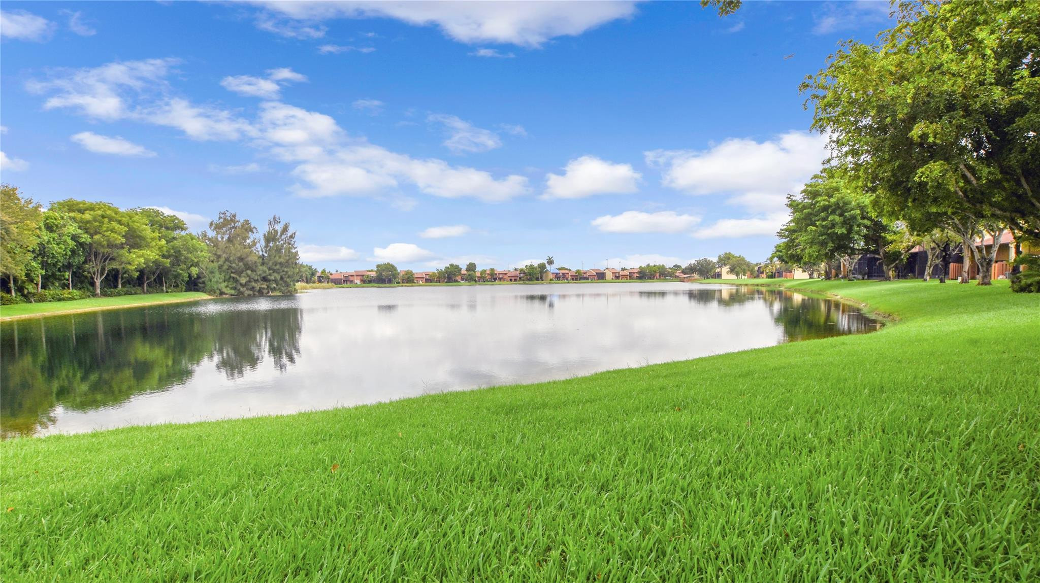 4285 South Pine Island Road, Unit 4285 Davie, FL 33328 - Photo 28 of 35 a view of a lake with houses in the back