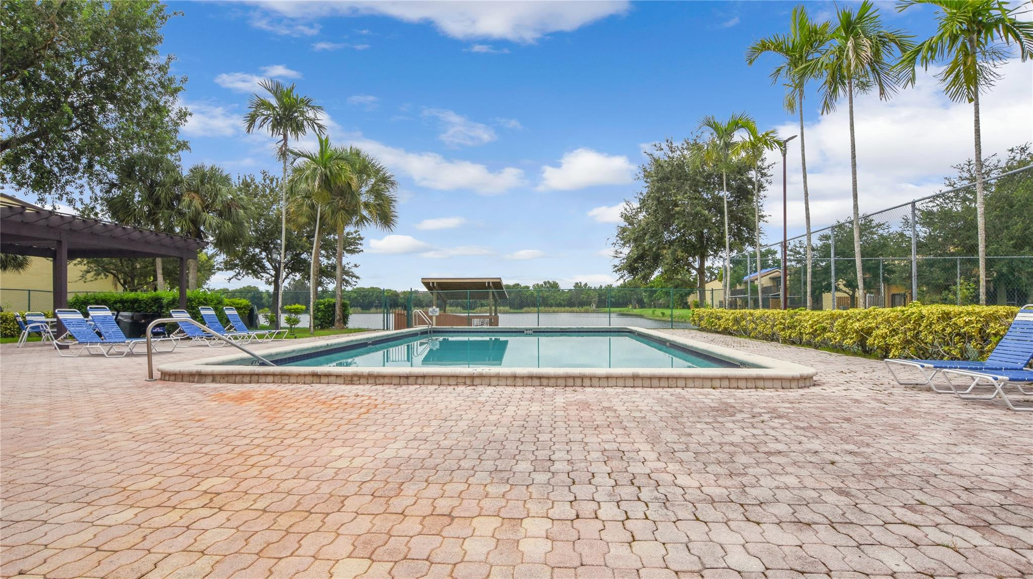 4285 South Pine Island Road, Unit 4285 Davie, FL 33328 - Photo 34 of 35 a view of a swimming pool with a patio