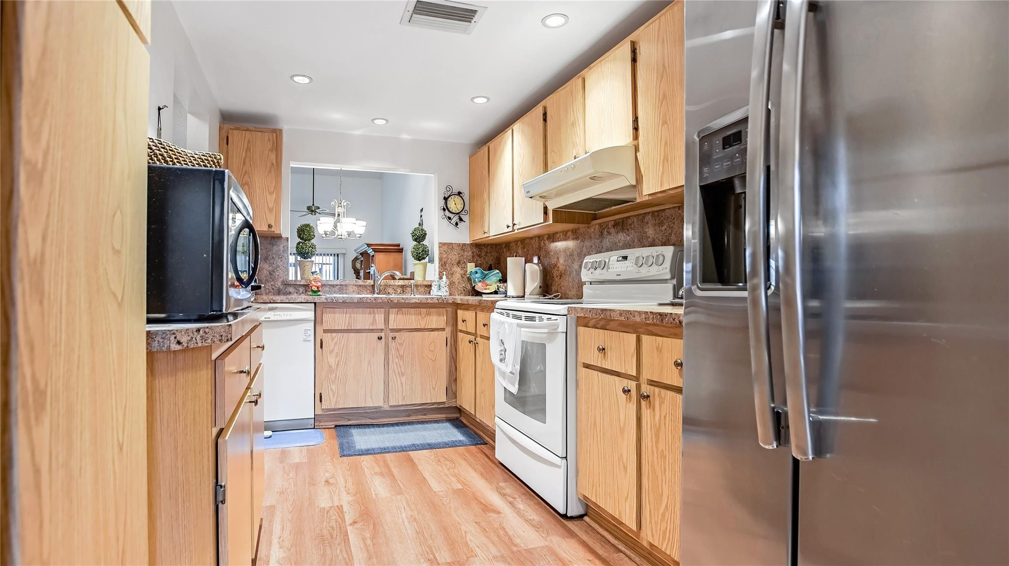 4285 South Pine Island Road, Unit 4285 Davie, FL 33328 - Photo 7 of 35 a kitchen with cabinets and stainless steel appliances