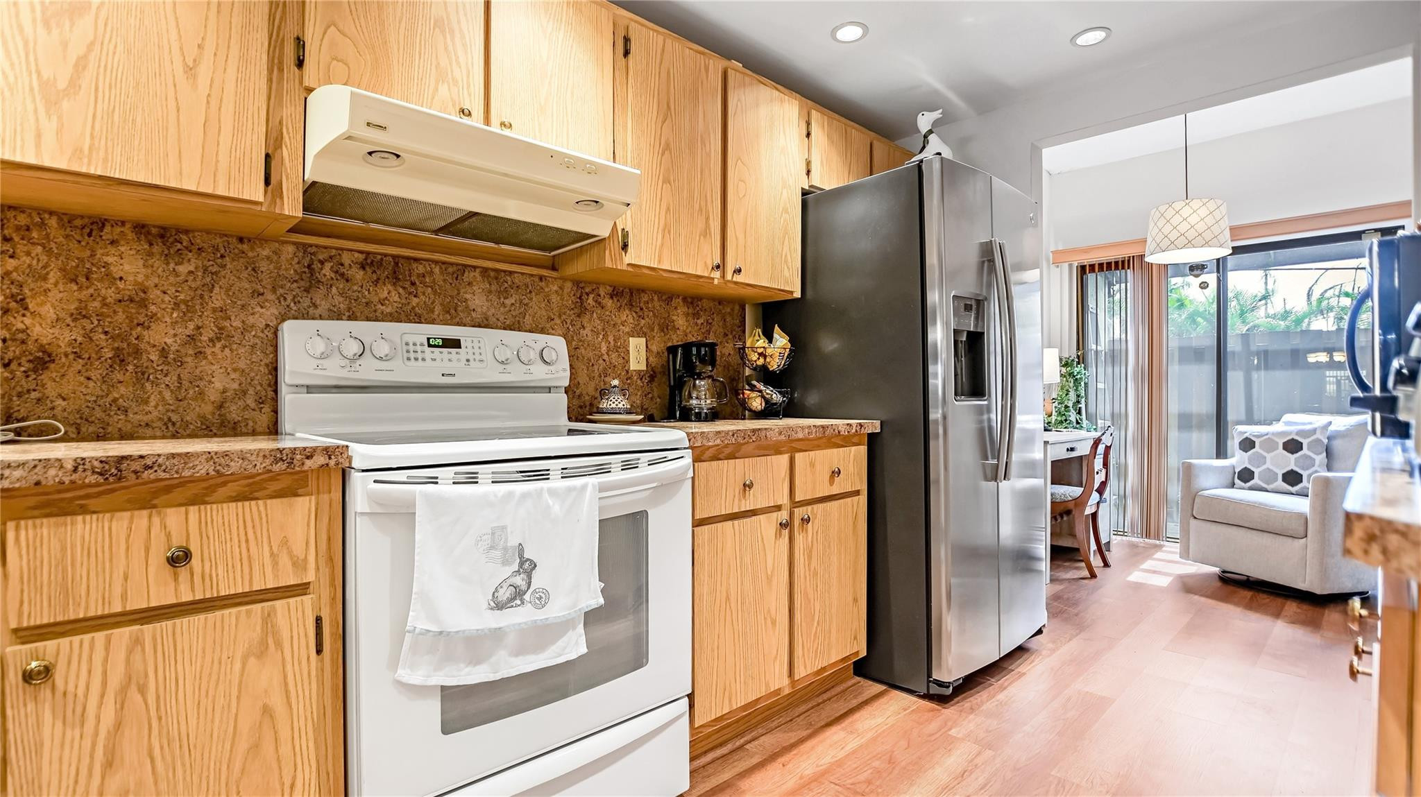 4285 South Pine Island Road, Unit 4285 Davie, FL 33328 - Photo 8 of 35 a kitchen with refrigerator and stove