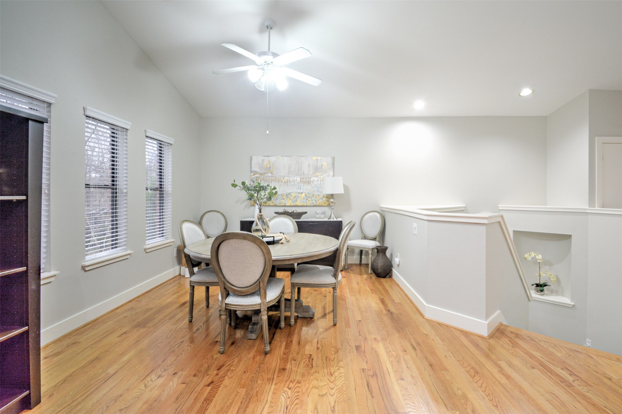 5225 Cornish Street, Unit 1 Houston, TX 77007 - Photo 14 of 22 a dining room with furniture a rug a potted plant and wooden floor