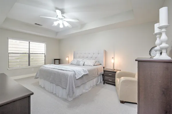 a bedroom with bed and window