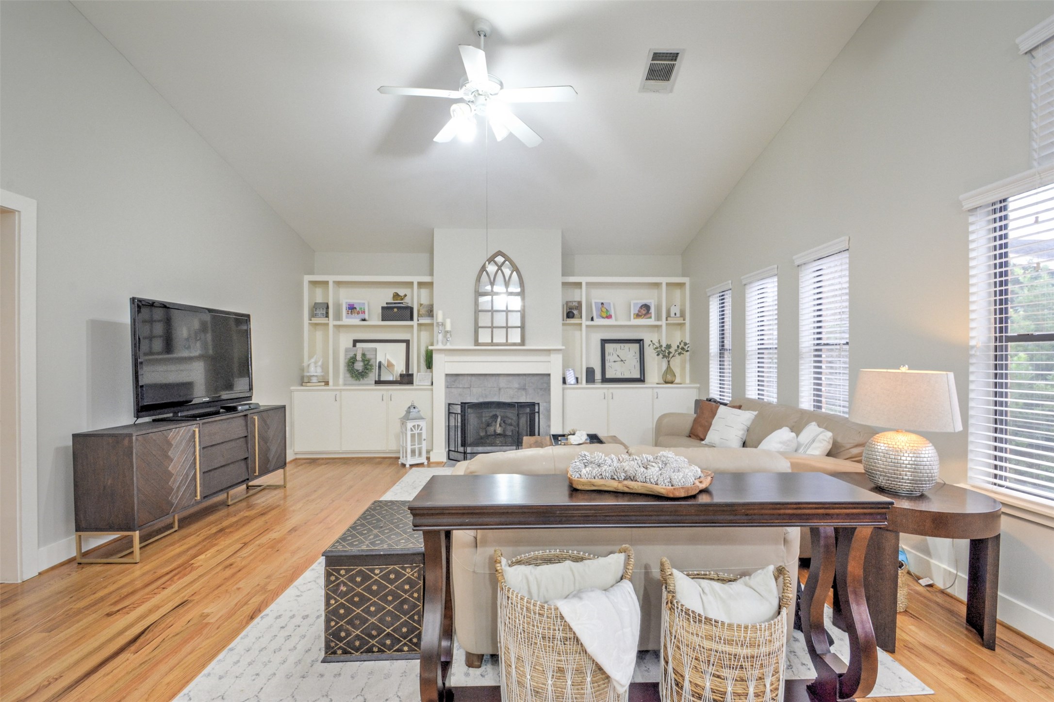 5225 Cornish Street, Unit 1 Houston, TX 77007 - Photo 9 of 22 a living room with fireplace furniture and a flat screen tv
