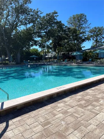 a view of swimming pool with a yard