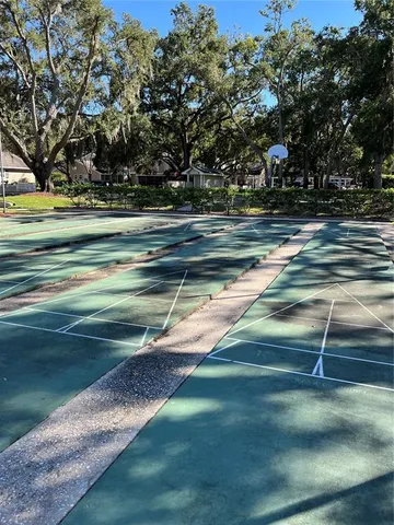 a sign board with wooden fence