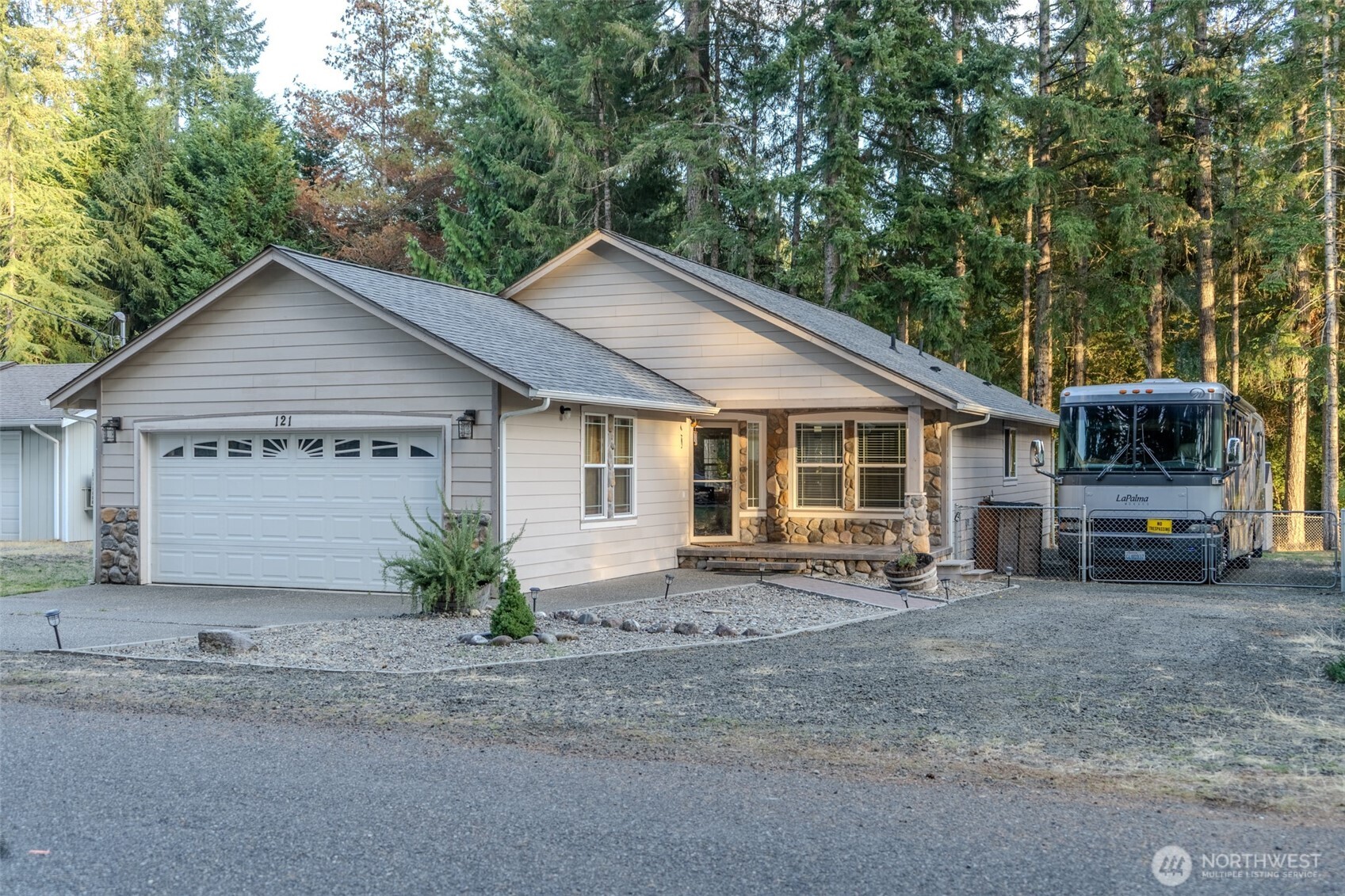 a view of a house with a yard and sitting area