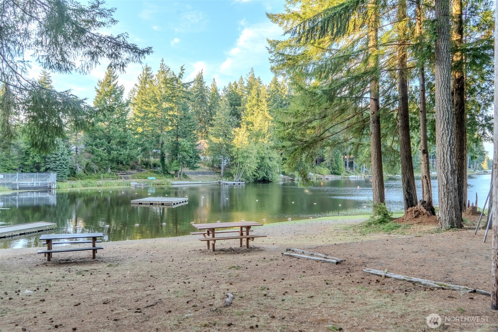 121 East Stavis Road Shelton, WA 98584 - Photo 25 of 35 a lake view with a bench and trees around