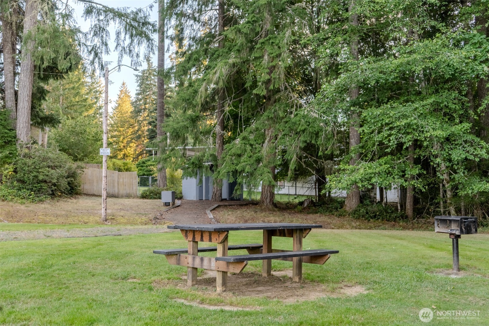 121 East Stavis Road Shelton, WA 98584 - Photo 27 of 35 a view of a backyard with table and chairs and a tree