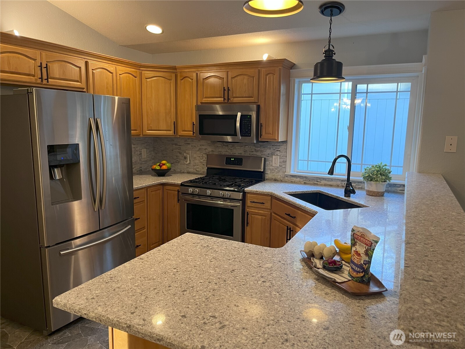 121 East Stavis Road Shelton, WA 98584 - Photo 4 of 35 a kitchen with refrigerator and microwave
