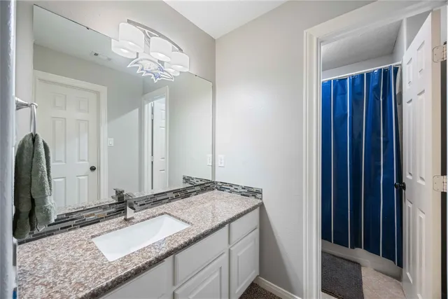 a livingroom with furniture and a large window