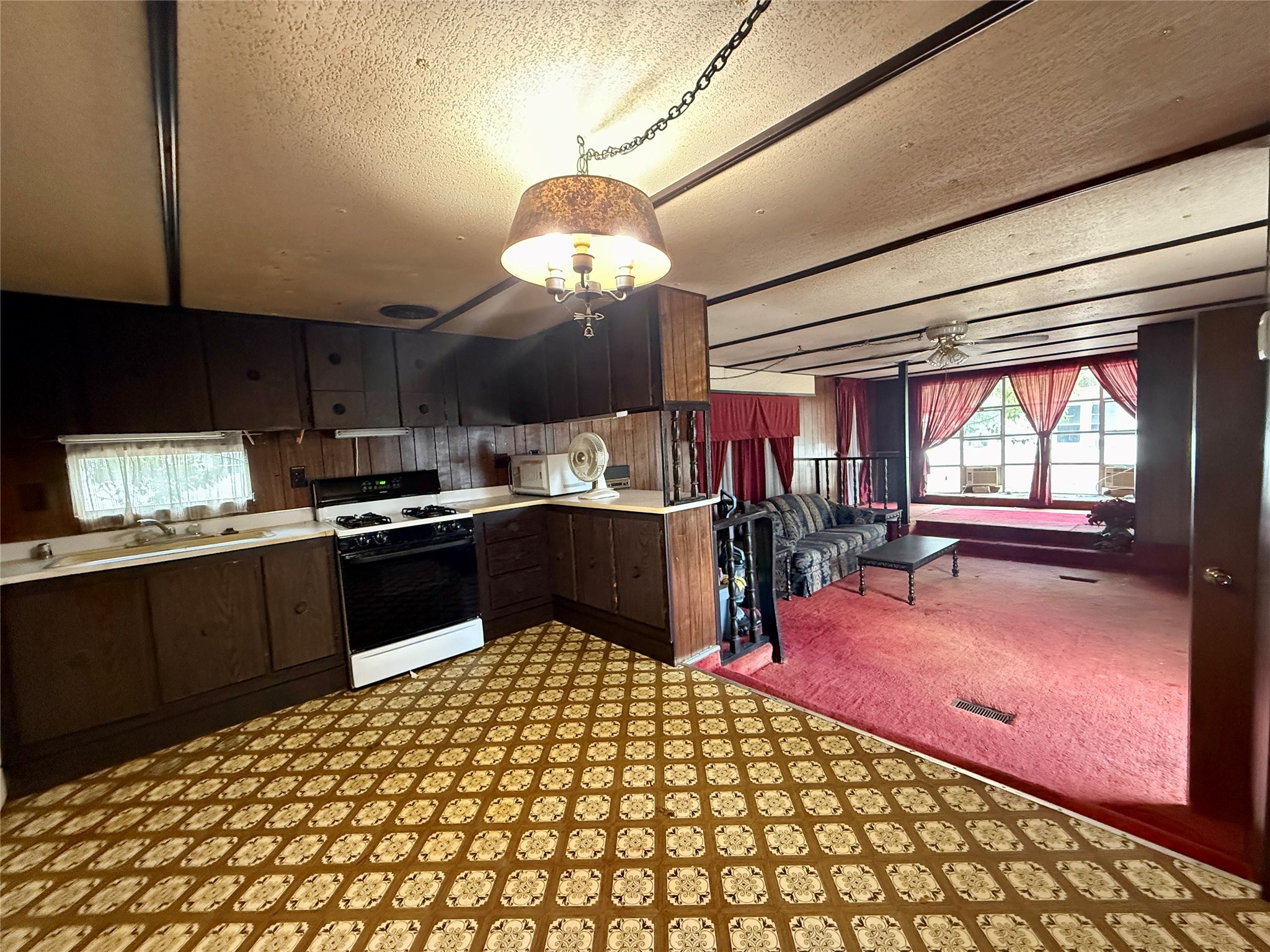 506 South Colorado Street Flatonia, TX 78941 - Photo 2 of 21 a kitchen with stainless steel appliances kitchen island granite countertop a refrigerator and a stove top oven