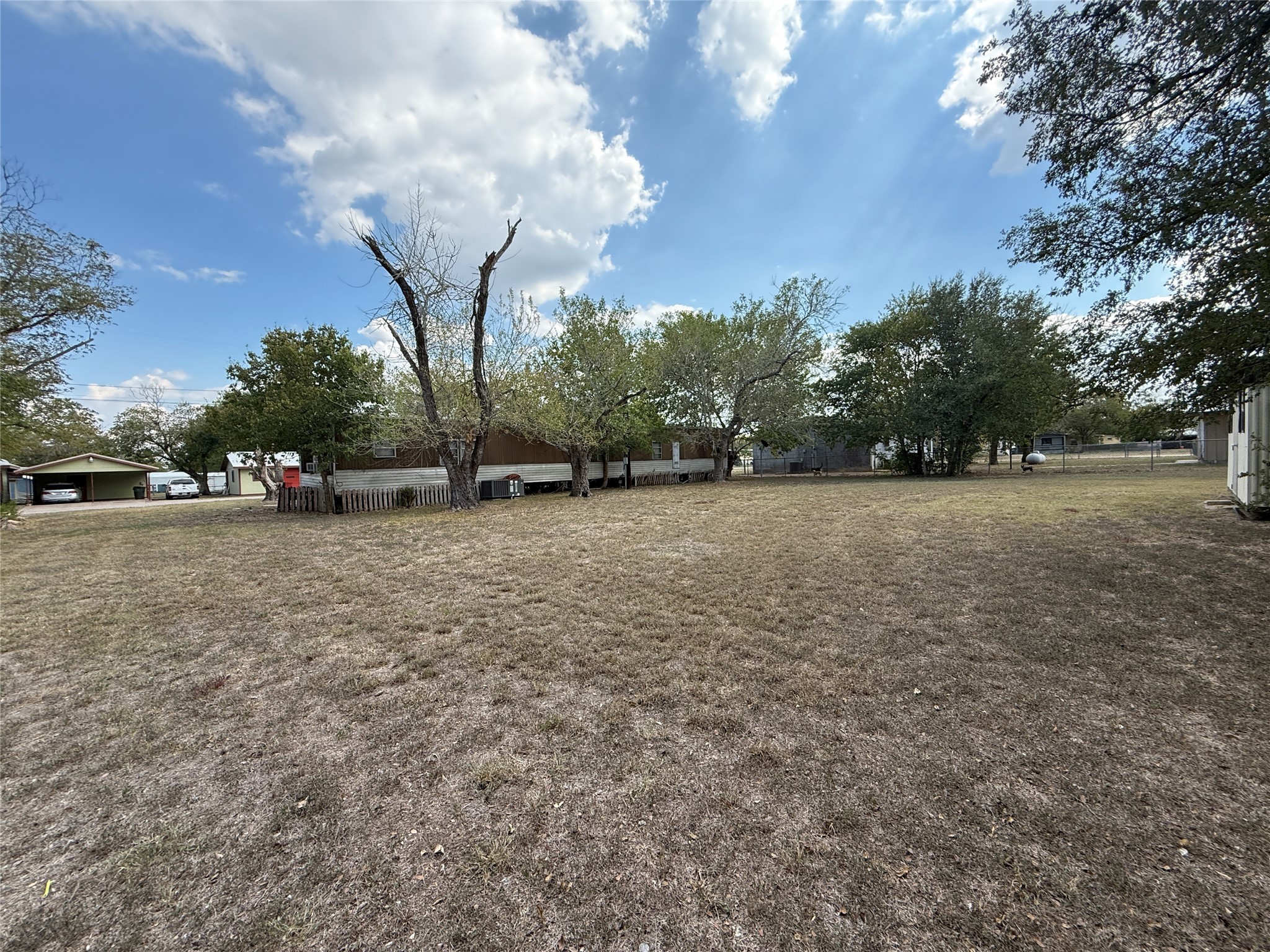 506 South Colorado Street Flatonia, TX 78941 - Photo 9 of 21 a view of a field of grass and trees