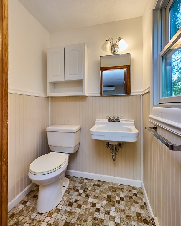 134 Tracy Circle Amherst, MA 01002 - Photo 11 of 37 a bathroom with a sink a toilet and a mirror