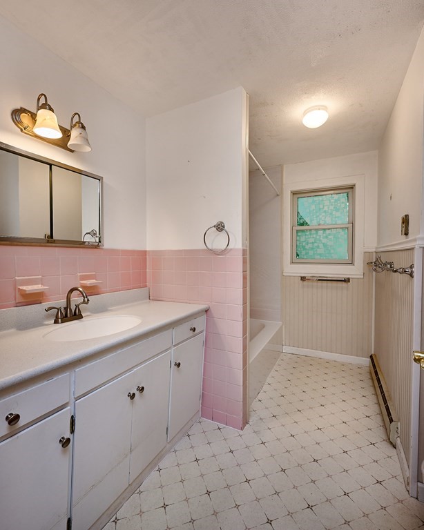 134 Tracy Circle Amherst, MA 01002 - Photo 16 of 37 a bathroom with a sink a vanity and mirror